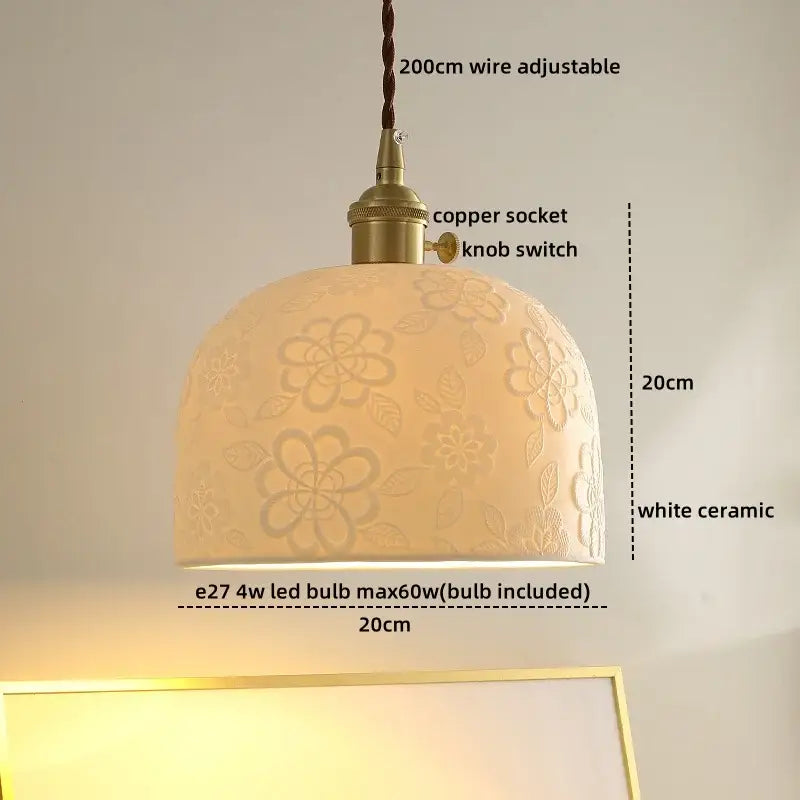 A warm cream-colored ceramic led pendant light with cloud pattern and brass-finished copper socket for dining room decorbites ceramic led