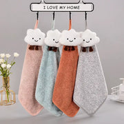 Four pastel pink mint green terracotta orange and heather gray decorbites cloudy day hand towels hang on a rack