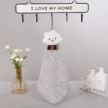 A plush decorbites cloudy day hand towel with white cloud shape brown bow tie and textured silver-gray fabric body