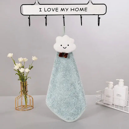 A soft light blue terry cloth hand towel with a plush white cloud top and brown bow tie from decorbites cloudy day set