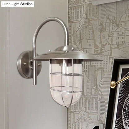 Lámpara de pared tipo jaula en negro/níquel estilo costero con bombilla de cristal transparente para sala de estar