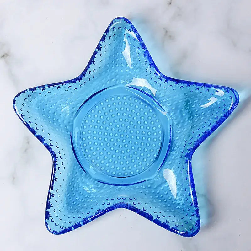 Coastal blue translucent glass dish plate saucer with star shape textured dotted surface and central circular indentation
