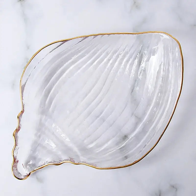 Clear glass seashell dish plate saucer with gold rim and ribbed texture for coastal blue dining room snack set
