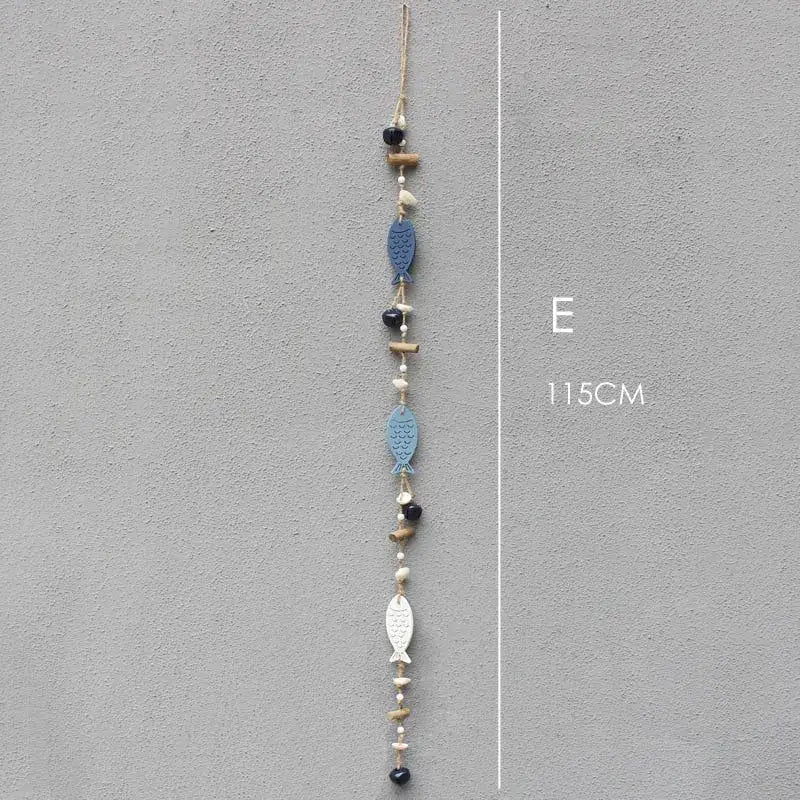 A 115cm coastal blue and white fish drift wood bells hanging chain with wood bells and black beads on twine for wall decor