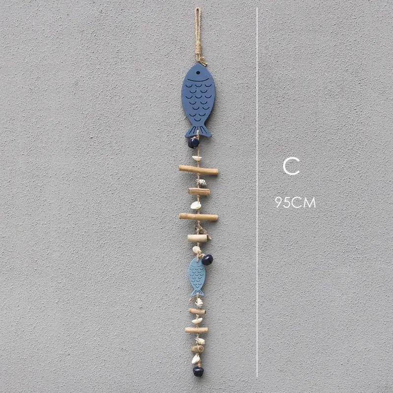 Coastal blue wooden fish drift wood bells with natural wood sticks seashells and dark beads living room wall decor