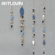 Coastal blue and white drift wood bells with painted wooden fish, shells, beads, and bamboo for living room wall decor