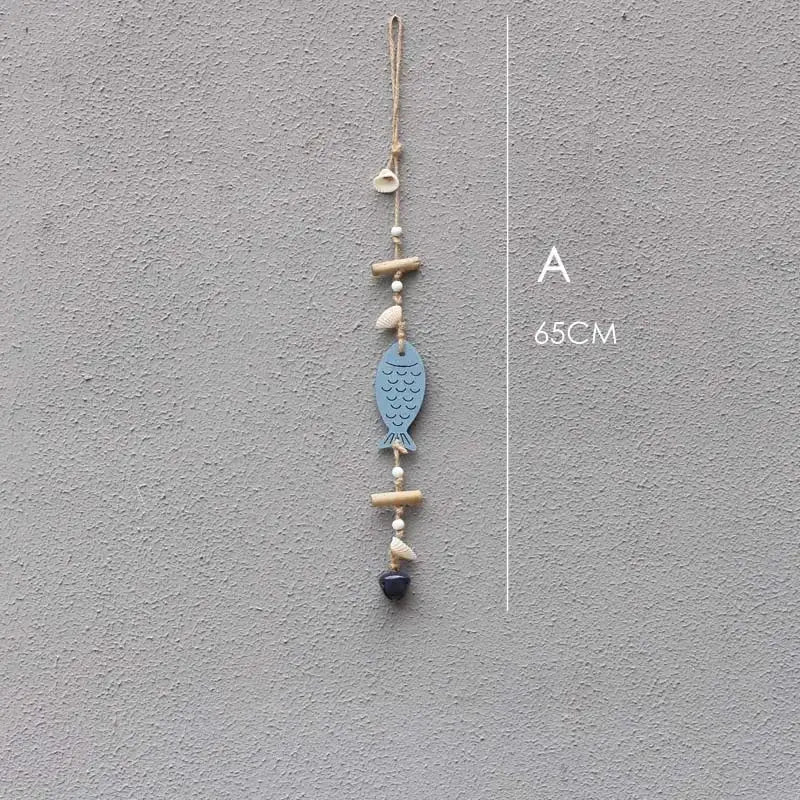 Coastal blue and white drift wood bells fish wall decor featuring textured scales, seashells, beads, and bamboo pieces