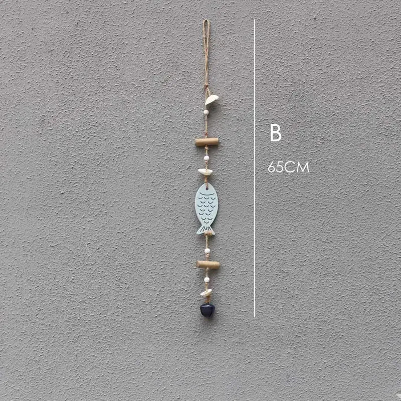Coastal blue and white fish drift wood bells made of painted metal with bamboo beads and twine loop wall decor
