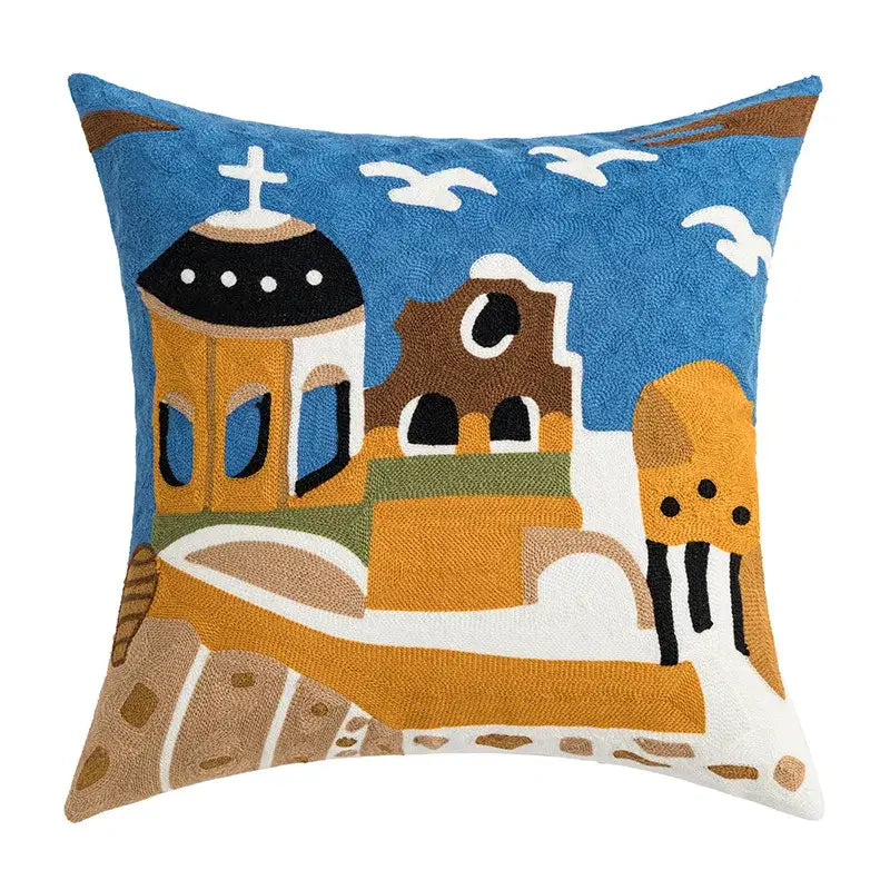 Blue cushion cover with embroidered coastal chic greek architecture design featuring buildings and seagulls decorbites coastal chic