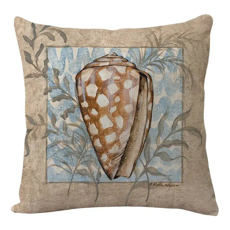 Beige decorbites coastal cushion featuring brown and cream conch shell with blue foliage on textured fabric for living room decor