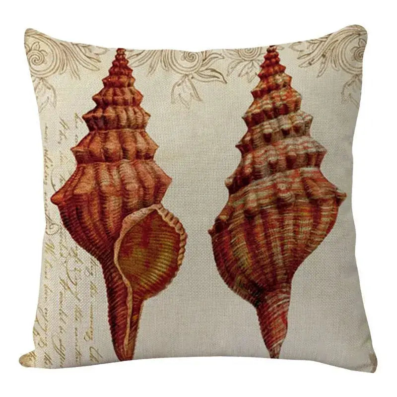 Beige linen decorbites coastal cushion cover with vintage reddish-brown conch shells and gold script for living room decor