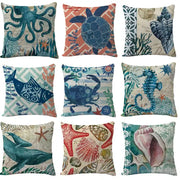 Set of nine decorbites coastal cushion covers with ocean-themed designs in teal and blue for living room decor