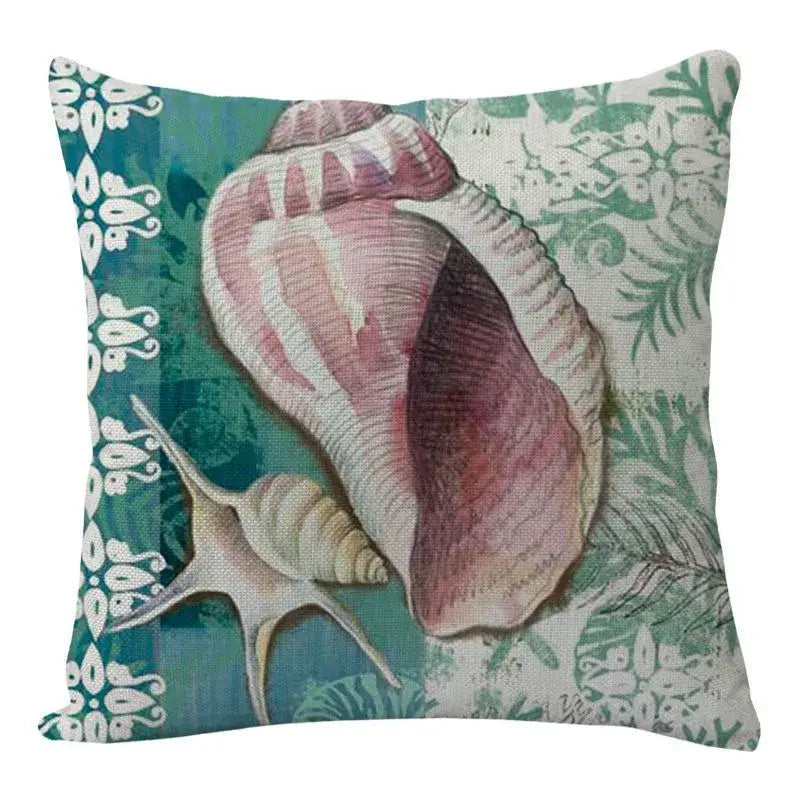 A decorbites coastal cushion featuring pink and beige seashells on textured fabric with teal green and white patterns