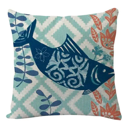 Decorbites coastal cushion cover featuring a navy blue fish with white patterns on teal and cream geometric background