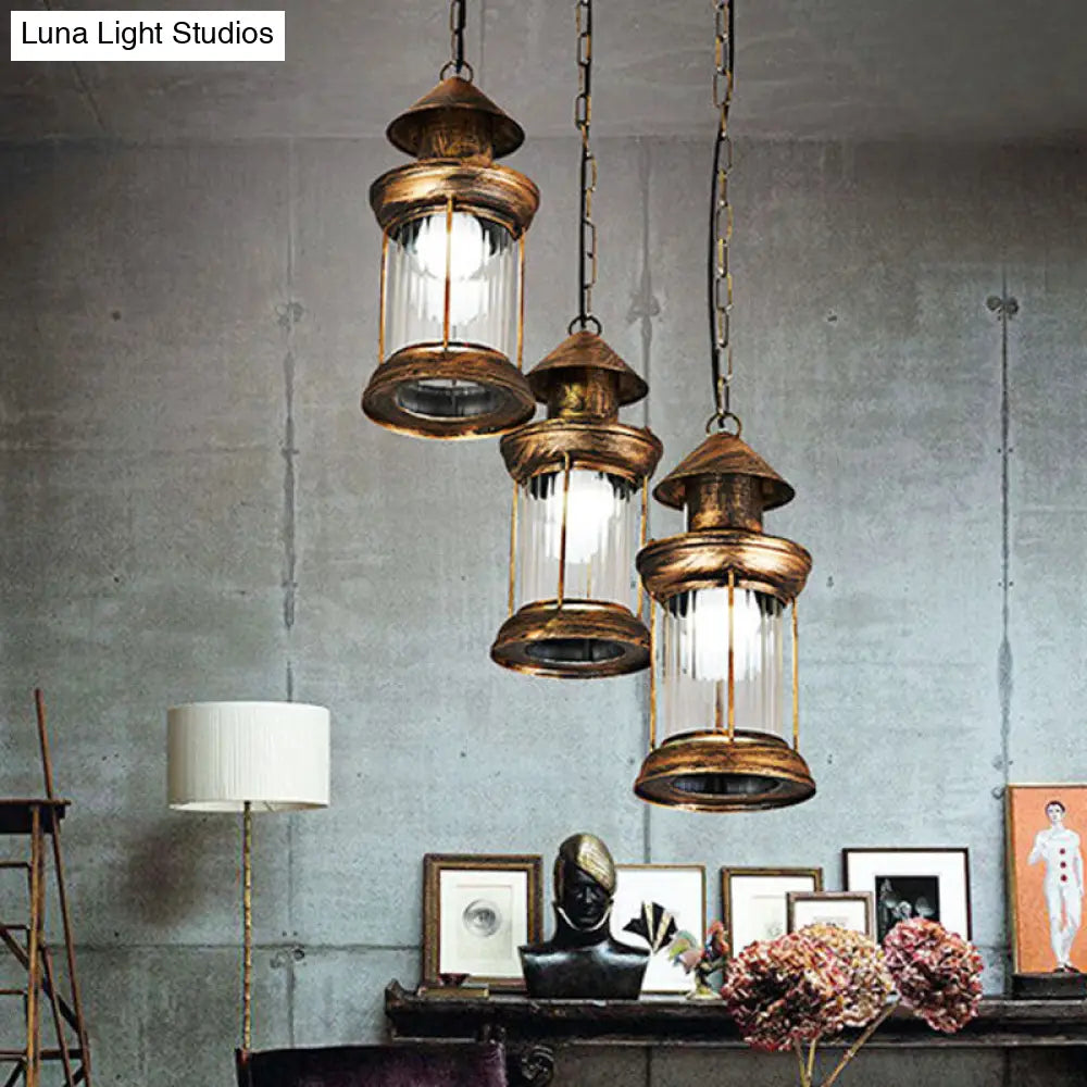 Coastal Kerosene 3-Head Pendant Lamp in Brass with Clear Ribbed Glass Shade