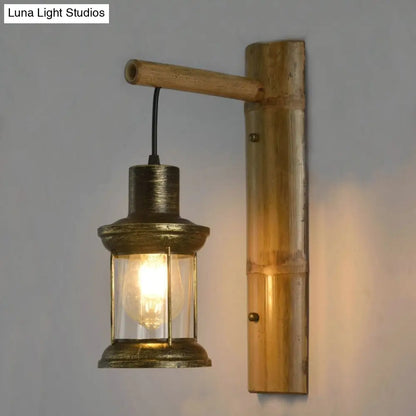 DecorBites™ Coastal Lantern 1-Head Wall Light Sconce with Clear Glass and Bamboo Backplate