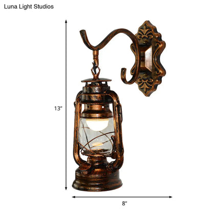 Coastal Living Room Wall Sconce - Clear Glass Light in Bronze Finish