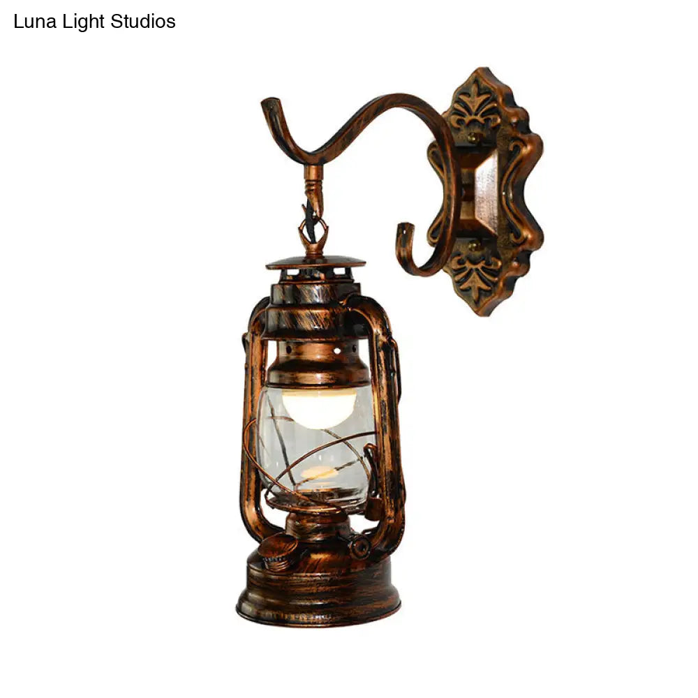 Coastal Living Room Wall Sconce - Clear Glass Light in Bronze Finish