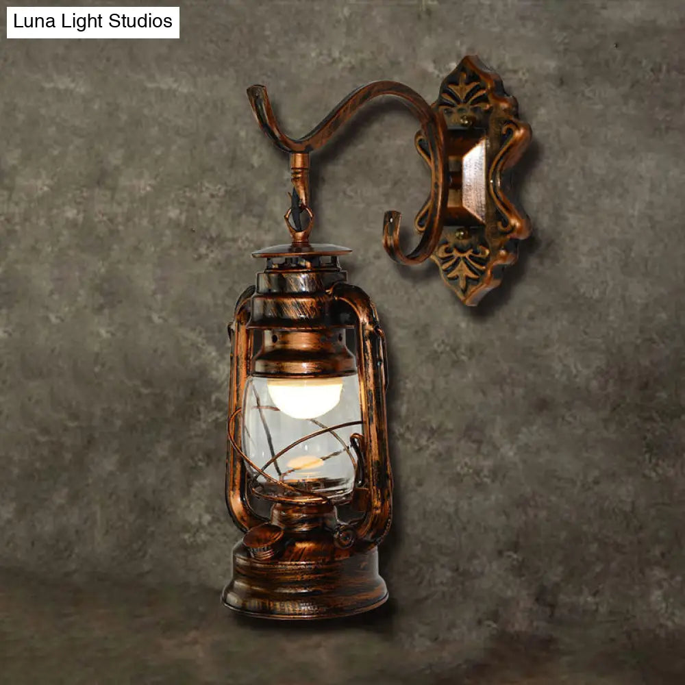 Coastal Living Room Wall Sconce - Clear Glass Light in Bronze Finish