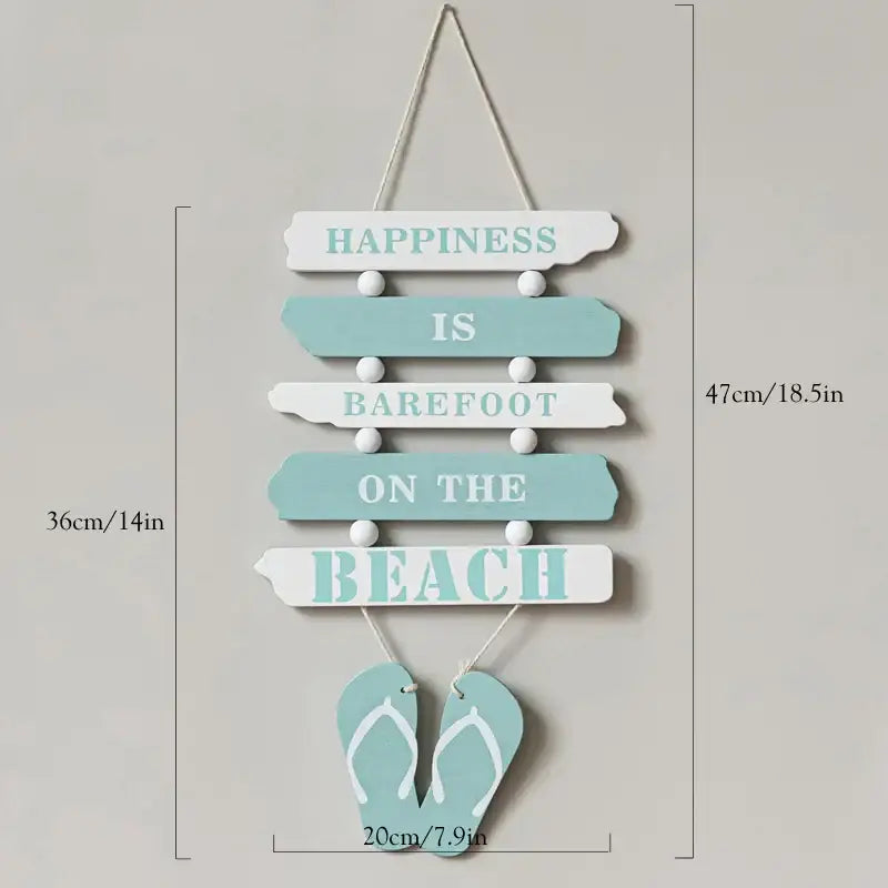 Coastal white and gray wooden ship model decor with a light blue wooden wall hanging featuring teal beach lettering and flip-flops