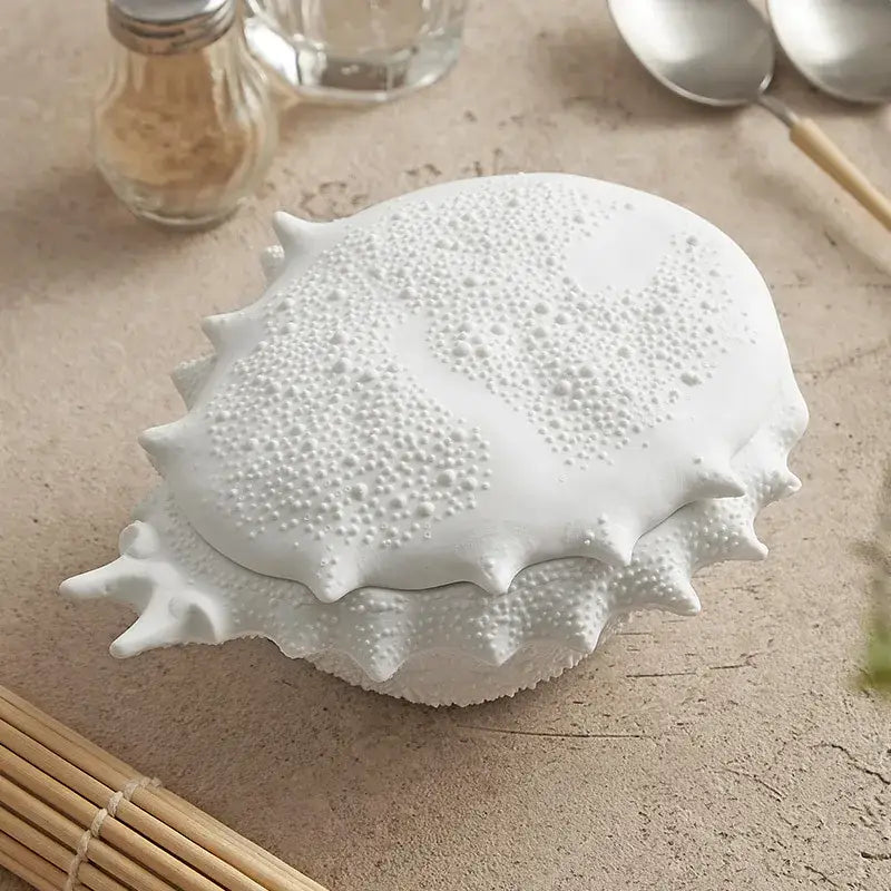 White ceramic shell ceramic soup bowl with textured bumpy surface and spiky edges for dining room decor