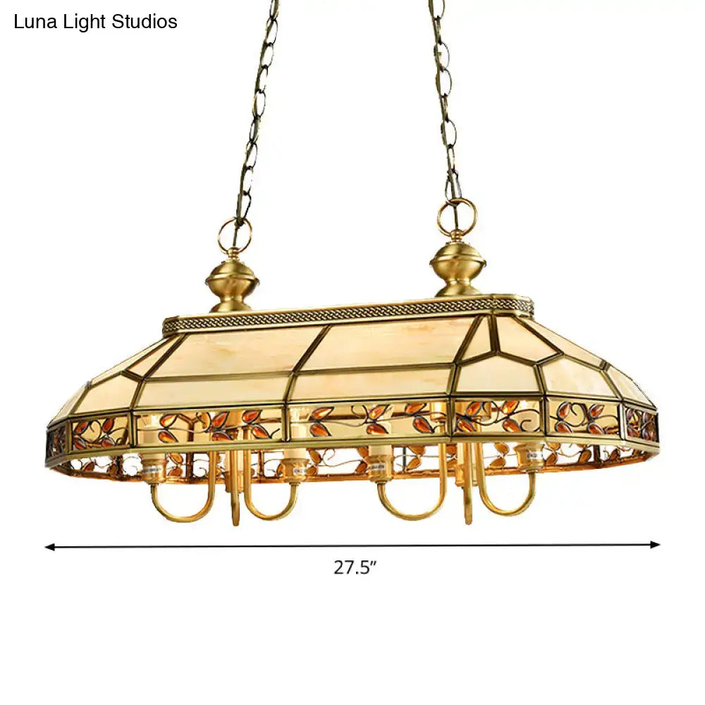 Gold-toned DecorBites™ colonial style pendant light with stained glass shade featuring amber and orange leaf motifs