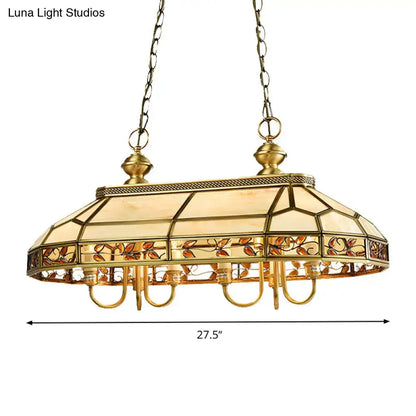 Gold-toned DecorBites™ colonial style pendant light with stained glass shade featuring amber and orange leaf motifs