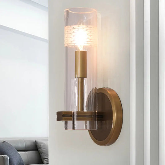 Colonialist Gold Wall Sconce with Clear Cylindrical Glass - Perfect for Living Room Lighting