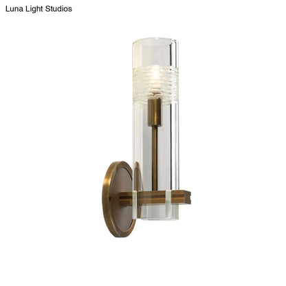 Colonialist Gold Wall Sconce with Clear Cylindrical Glass - Perfect for Living Room Lighting