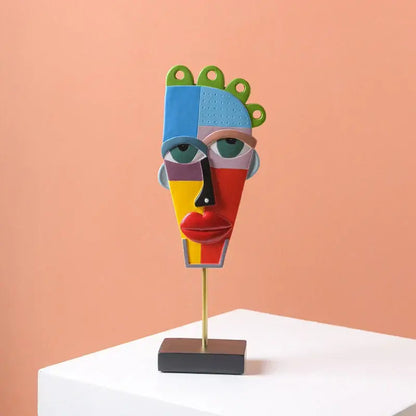 Colorful african abstract face monkey sculpture with vibrant geometric sections on gold stand for living room decorbites african abstract decor