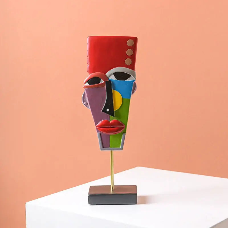 Colorful african abstract face monkey sculpture with bold red blue green and purple geometric decorbites african abstract decor