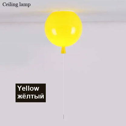 A bright yellow decorbites colorful balloon ceiling light with a glossy finish and white cord for bedroom and dining room decor
