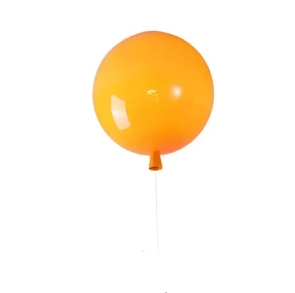 A bright orange glossy colorful balloon led wall lamp with thin string from decorbites for kids bedroom decor