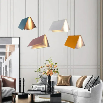 Modern book pendant lamp in teal white mauve and mustard yellow with layered wooden interiors for living room decorbites book pendant