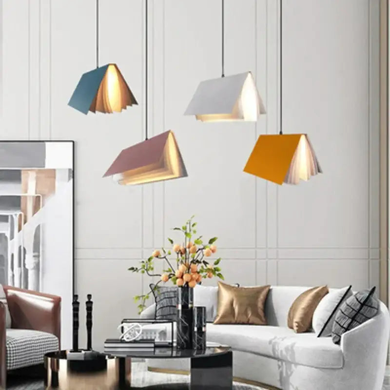 Modern book pendant lamp in teal white mauve and mustard yellow with layered wooden interiors for living room decorbites book pendant