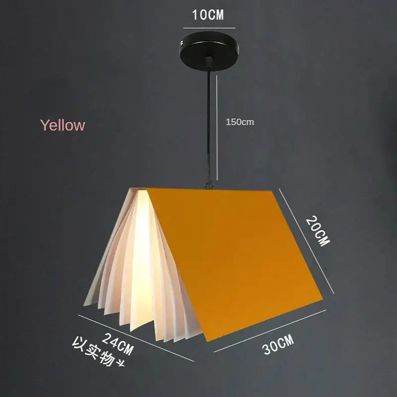 A colorful book pendant lamp with a yellow cover and translucent white pages that diffuse warm light for living room decor