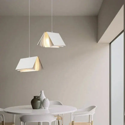 White minimalist book pendant lamp with layered paper design suspended by thin cords for living room decorbites decor