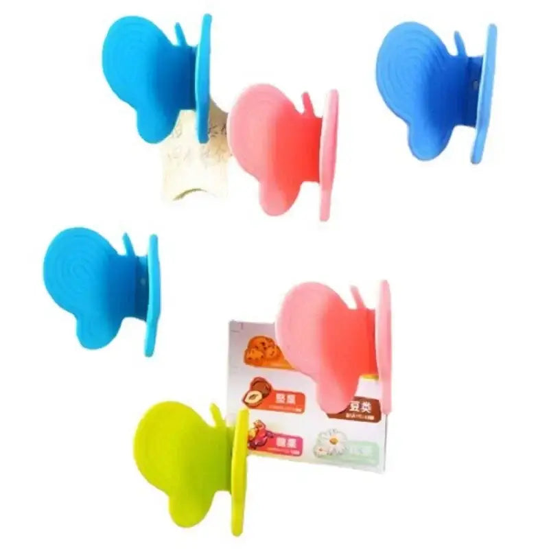 Brightly colored blue pink and green colorful butterfly silicone insulation plate clamps kitchen tool by decorbites butterfly silicone