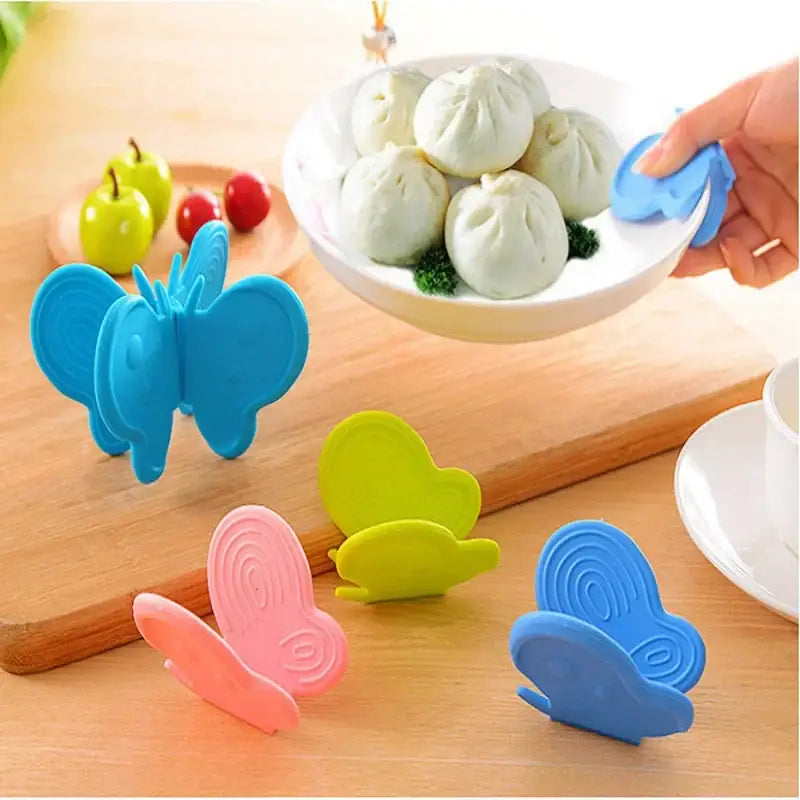 Colorful decorbites butterfly silicone insulation plate clamps in blue pink and green for kitchen use