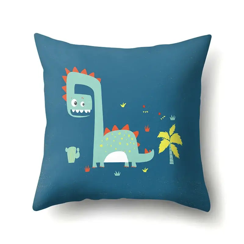 Blue throw pillow with colorful cartoon dino baby design featuring orange spikes yellow spots for decorbites dino baby decor