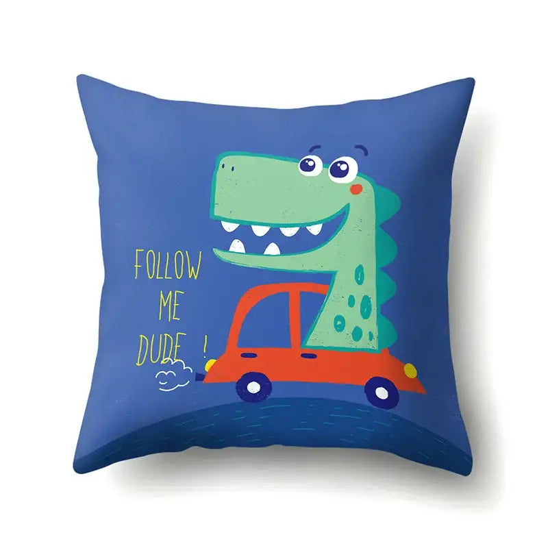 Colorful dino baby pillowcase by decorbites features a blue throw pillow with a green dinosaur in an orange car decorbites dino baby
