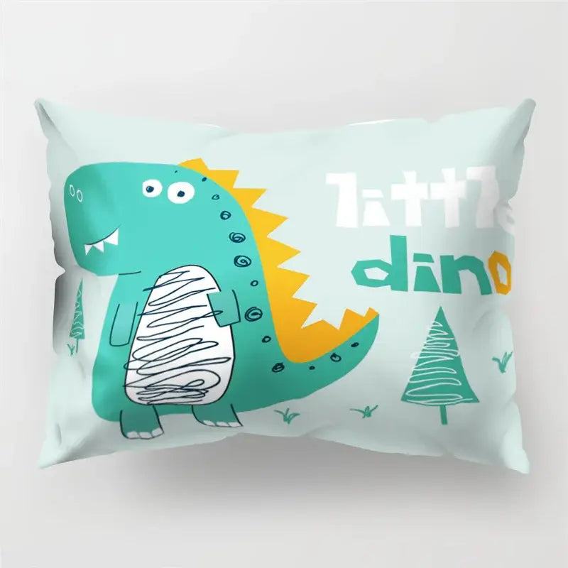 A mint green cartoon dinosaur pillowcase with teal and yellow accents and playful little dino lettering for kids decorbites cartoon dinosaur decor