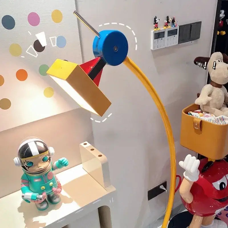 A vibrant led floor lamp with a blue circular head and yellow flexible arm for living room accent lighting
