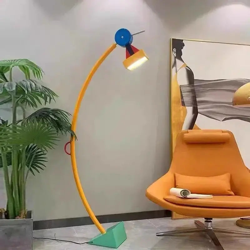A vibrant yellow led floor lamp with a blue head, red accent, and green base for living room accent lighting