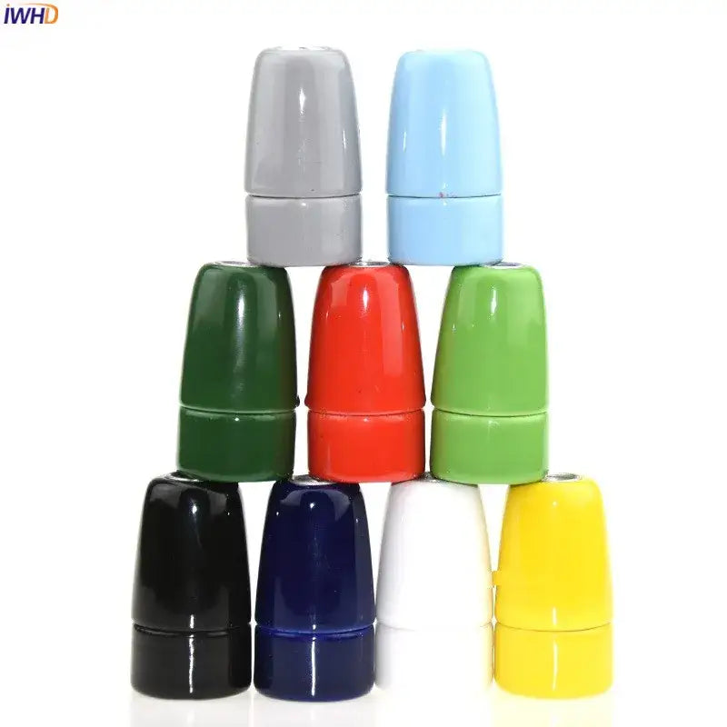 A pyramid of colorful glossy ceramic decorbites ceramic e14 socket bulb holders in gray blue green red black navy white yellow