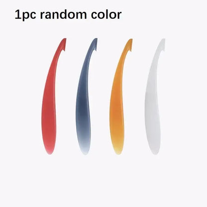 A sleek curved shoe horn in random color from the decorbites citrus zester peeler knife set of 4 kitchen fruit spoons
