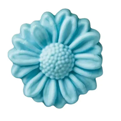 A light blue daisy silicone cake mold with detailed petals and textured center for baking use