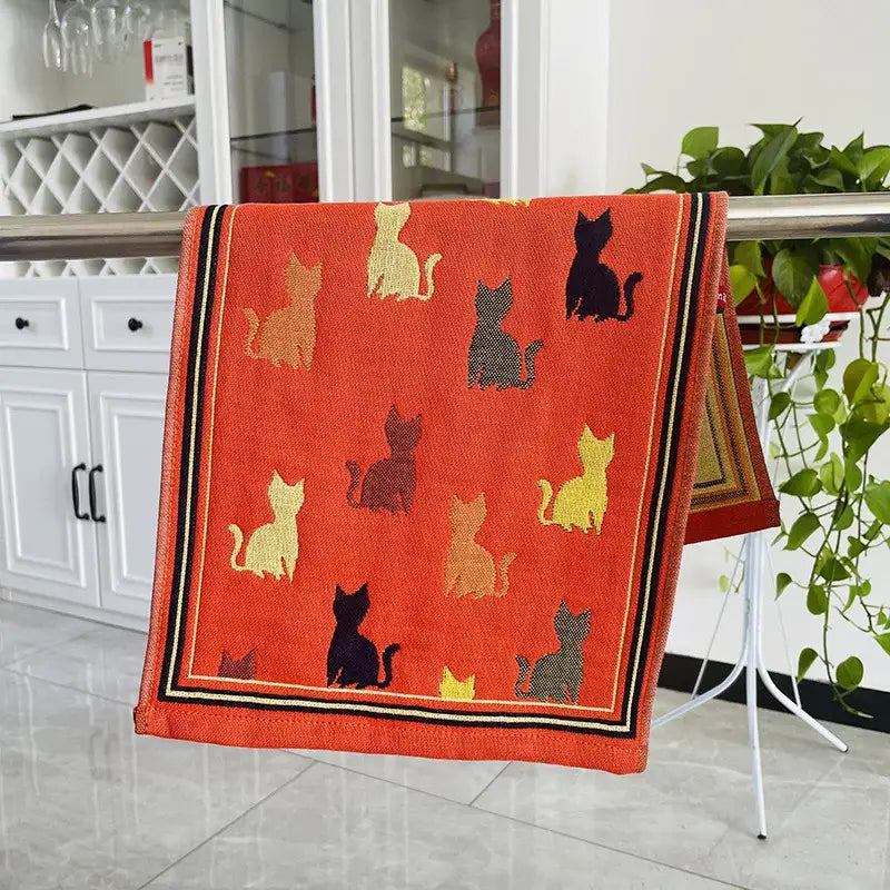 Vibrant orange cat gauze hand towels set of 4 featuring playful black yellow and brown cat silhouettes with dark border stripes