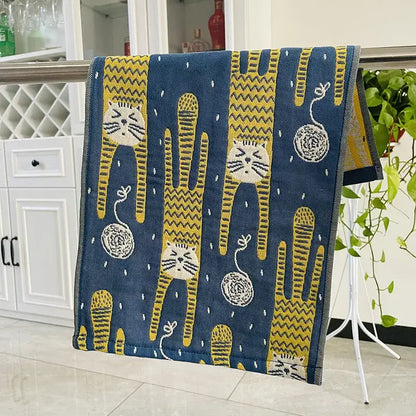 Blue cat gauze hand towel with yellow and white cartoon cats hanging on metal rack from decorbites hand towels set
