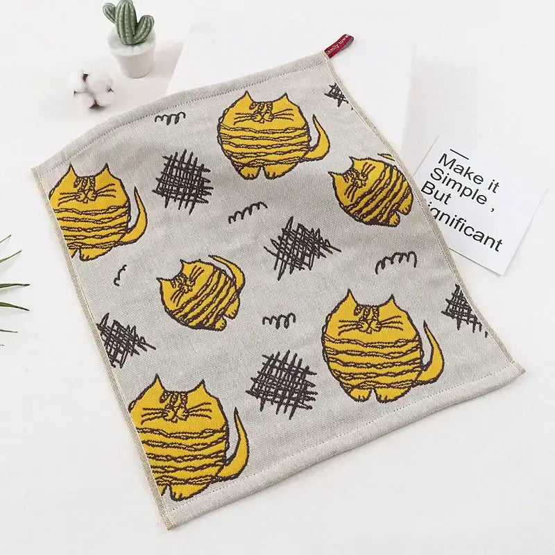 Gray cat gauze hand towel with playful yellow cartoon cats and black stripes from colorful dinosaur cat gauze set decorbites hand towels
